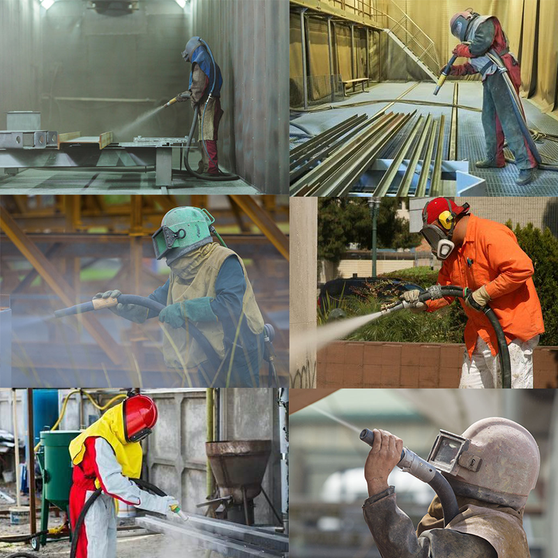 Arbeiter bedienen Sandstrahlschläuche